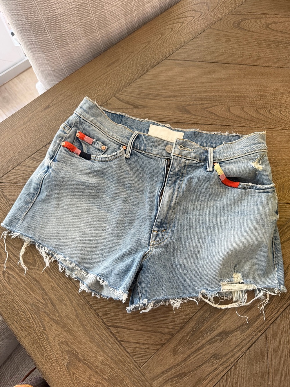 MOTHER Light Wash Distressed Denim Shorts with Colorful Pocket Trim